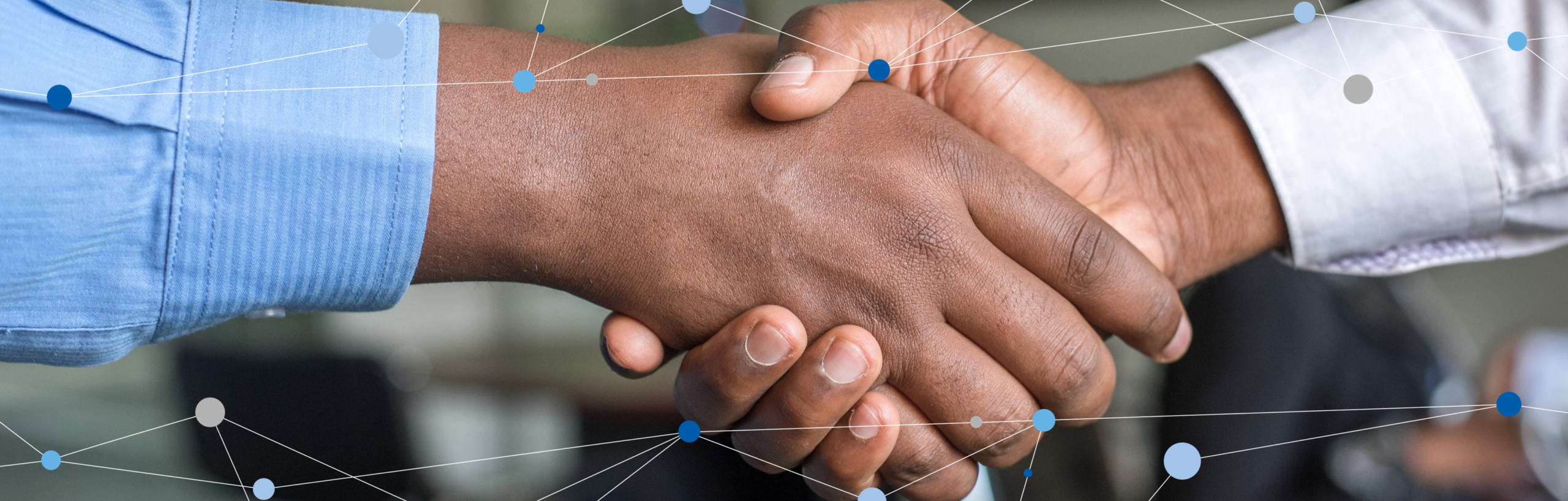 A photograph of two hands shaking. The hands have dark skins, and they are wearing long sleeves shirts. The background is blurred. ovr the top, top and bottom of the photo are graphical lines connected by blue dots.